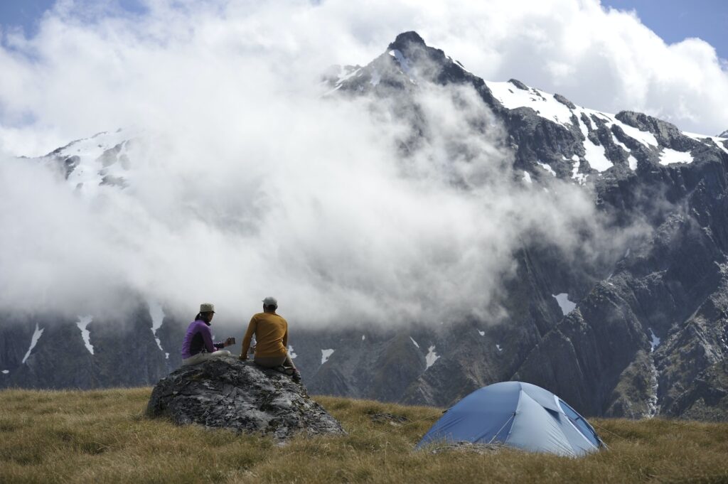 Couple camping in mountains, New Zealand